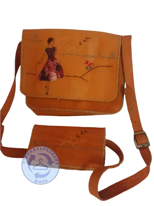 Gebrauchte Leder-Handtasche in braun mit bemalter Frau im Blumenkleid